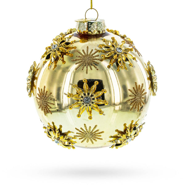Jeweled Snowflakes Adorning a Golden Glossy Glass Ornament